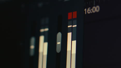 close up of an audio mixer screen during video editing