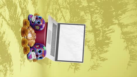 Day-of-The-Dead-Festival,-Dia-de-Muertos-,-Design-Mockup,-Mexico,Laptop,-Skulls,-Traditional-Floral-and-Pastry,-Yellow-Background,-Vertical