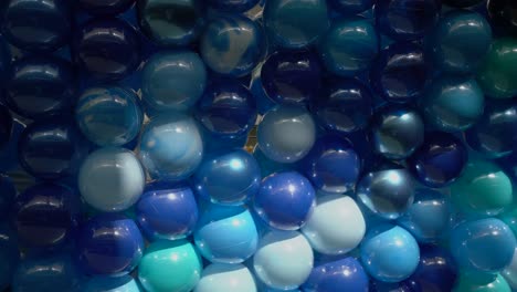 panning view of the background of multicoloured stacked balloons