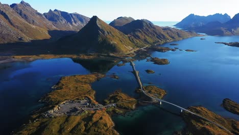 Aerial-view-of-Fredvang-Bridge-and-Volanstinden-mountain,-Lofoten,-Norway