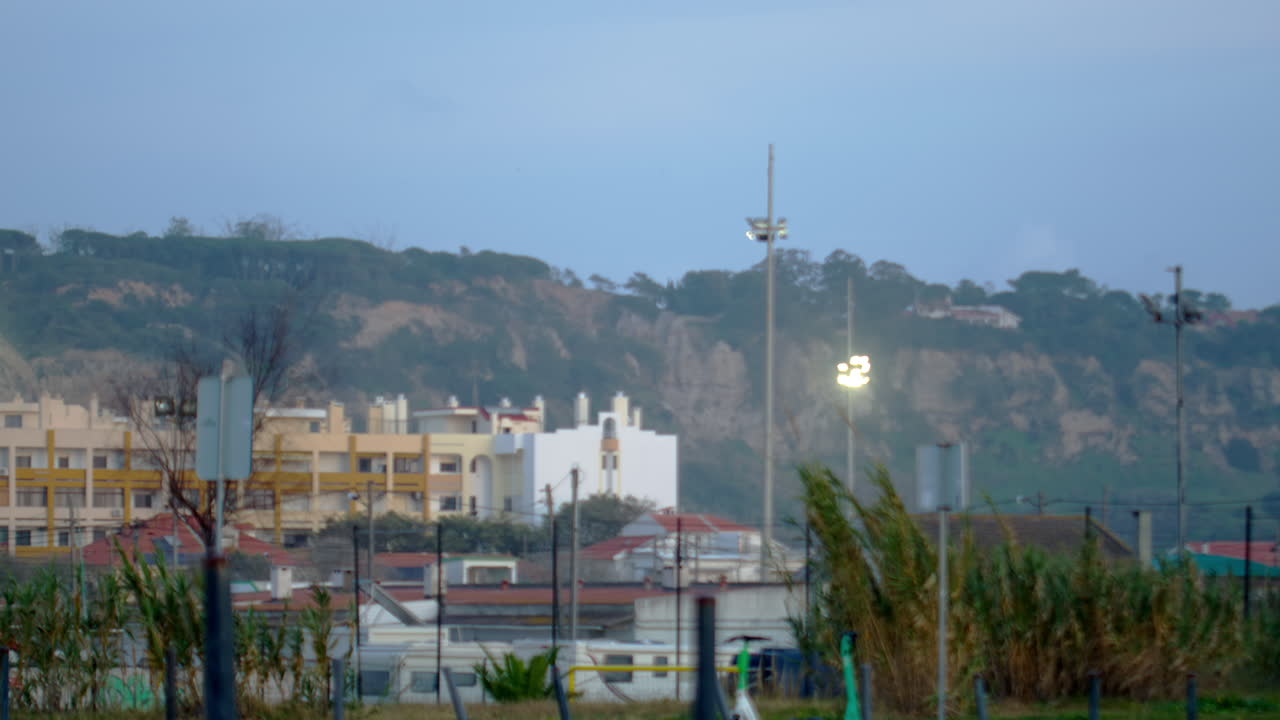 A light turning on at a football field.