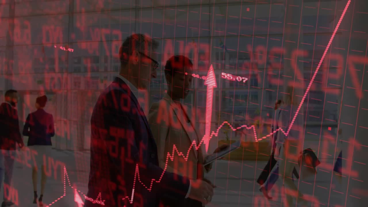 Two colleagues discussing rising stock values using red digital graph overlay in finance office