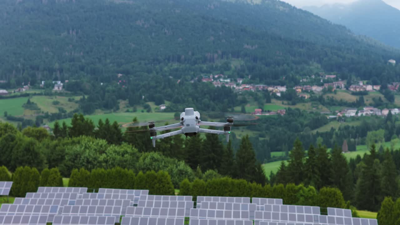 Drone flying over solar panel farm, renewable energy technology for sustainable power generation, Italy. Aerial