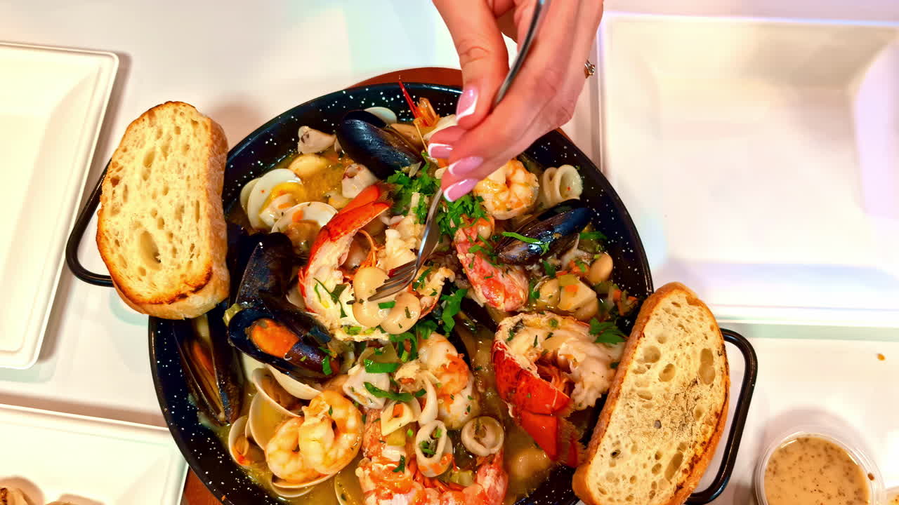 Seafood stew with clams, mussels, shrimp and lobster served with grilled bread