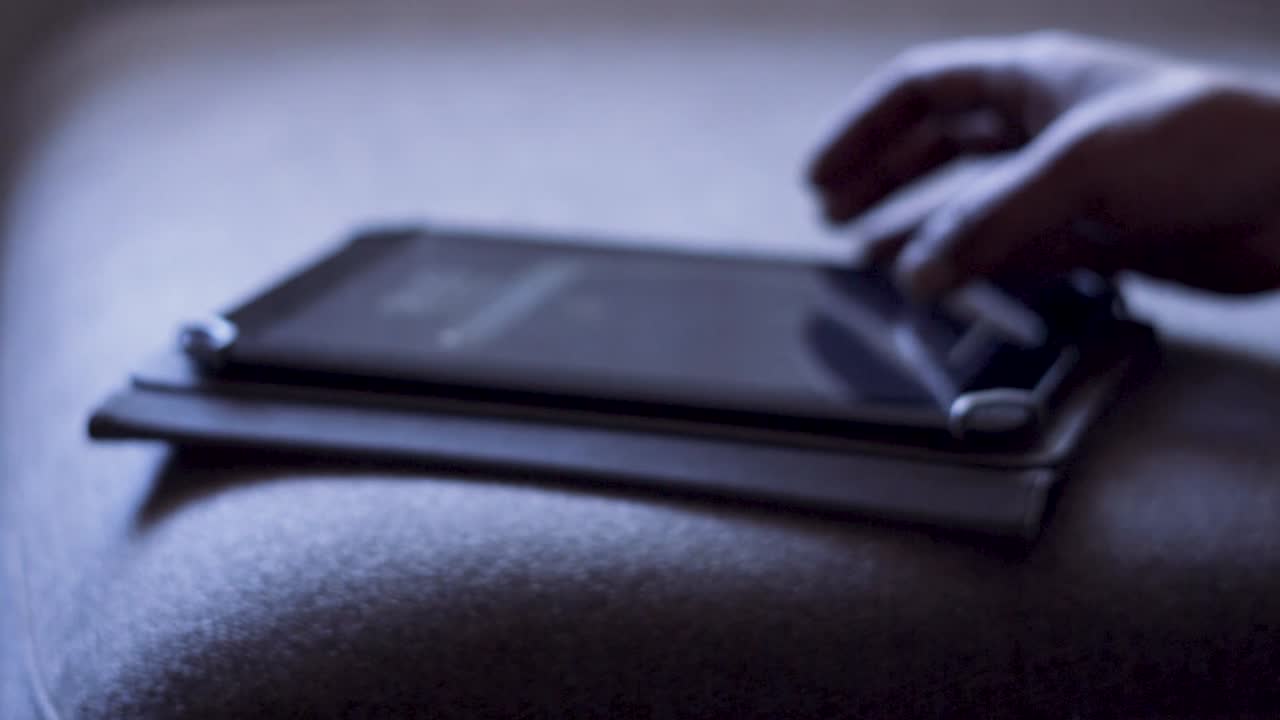 Man using a tablet computer at home