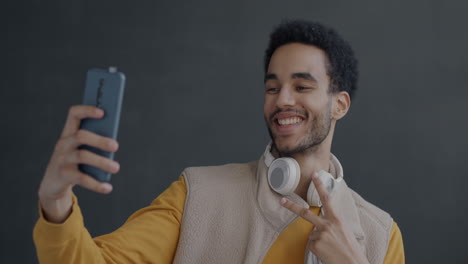 man taking a selfie with smartphone