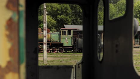 old rusty locomotives on vintage train station