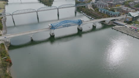 Wide-aerial-of-the-Market-Street-and-Walnut-Street-bridges-during-the-Head-of-the-Hooch-boat-rowing-race-in-Chattanooga,-TN