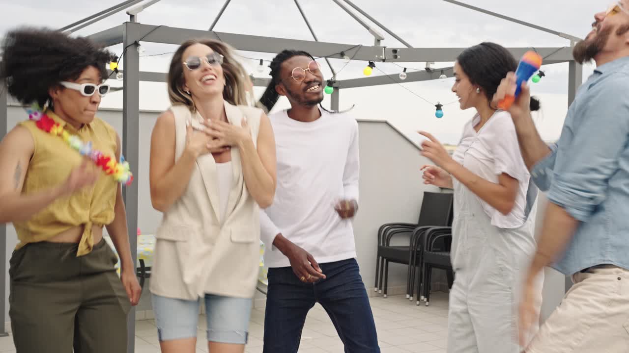 Group of friends celebrating at a rooftop party