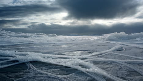 dramatic frozen lake landscape with unique ice patterns