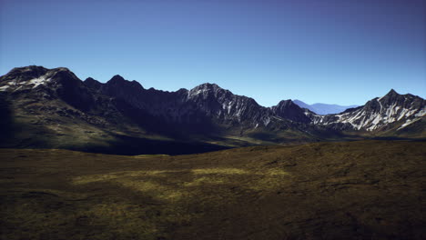 a stunning view of a rugged mountain range basking in sunlight
