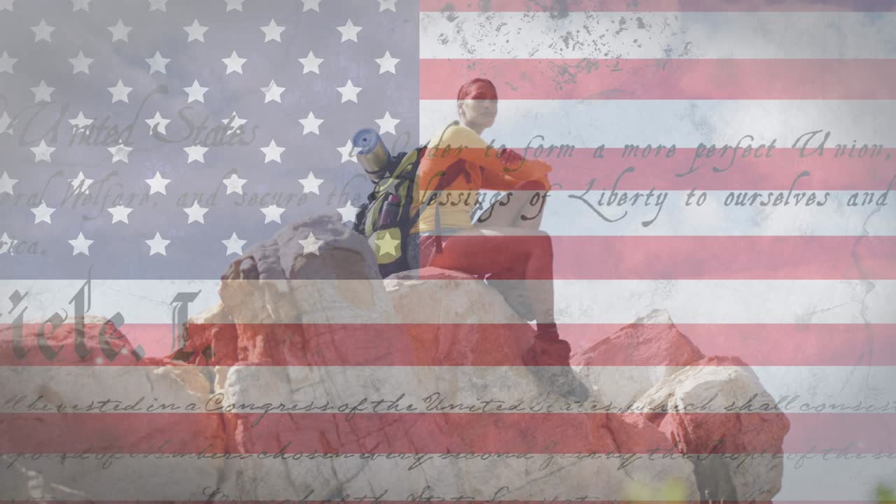 animación de la bandera estadounidense y texto moviéndose sobre la mujer sentada en la roca
