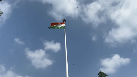 indian national flag (tiranga) fluttering against cloudy sky
