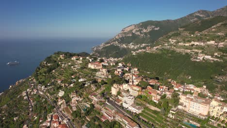 drone flying in circulair motion over a mountain village on the amalfi coast in italy in 4k