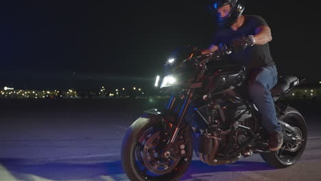 motorcyclist performing stunt at night