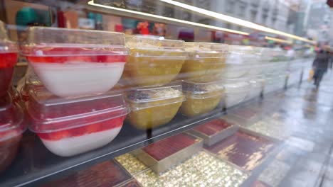 delicious desserts displayed in a shop window