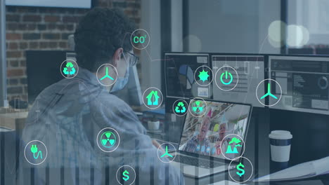 Animation-of-multiple-graphs,-icons-over-diverse-man-wearing-mask-discussing-reports-on-video-call