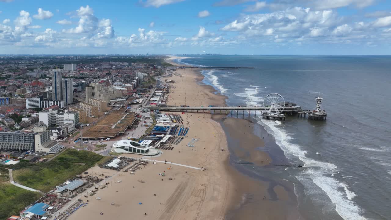 Aerial View of a Coastal Town with a Beach and Pier