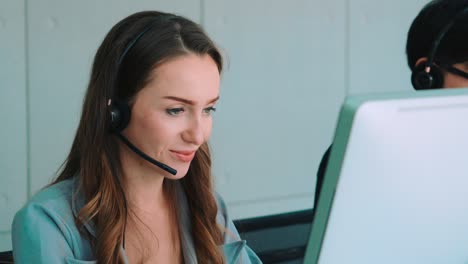 Business-people-wearing-headset-working-in-office