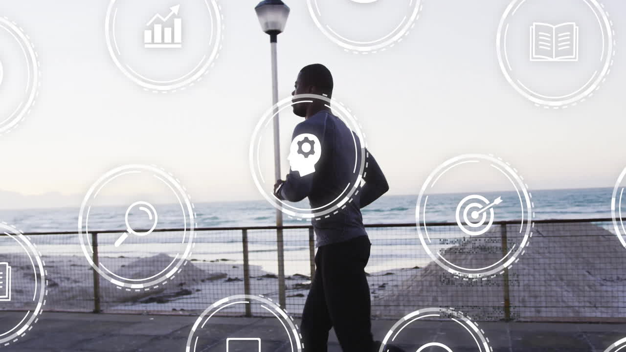 Jogging by ocean, man interacting with digital animation icons in scenic view