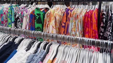 close up of a rack of clothes for sale in a store