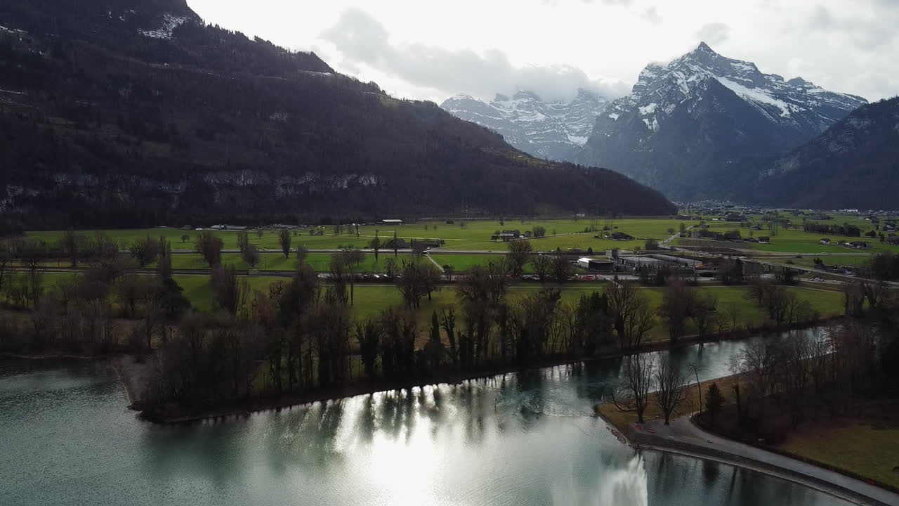 Drone shot of the lake Walensee in Weesen in a cloudy day. Canton St. Gallen, Switzerland.