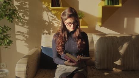 woman reading a book in a cozy cafe
