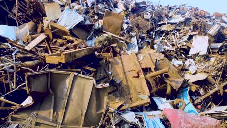 Panorama-of-heap-of-metal-scrap-at-steel-fabrication-industry