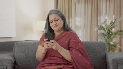 Happy-Indian-old-woman-chatting-on-phone