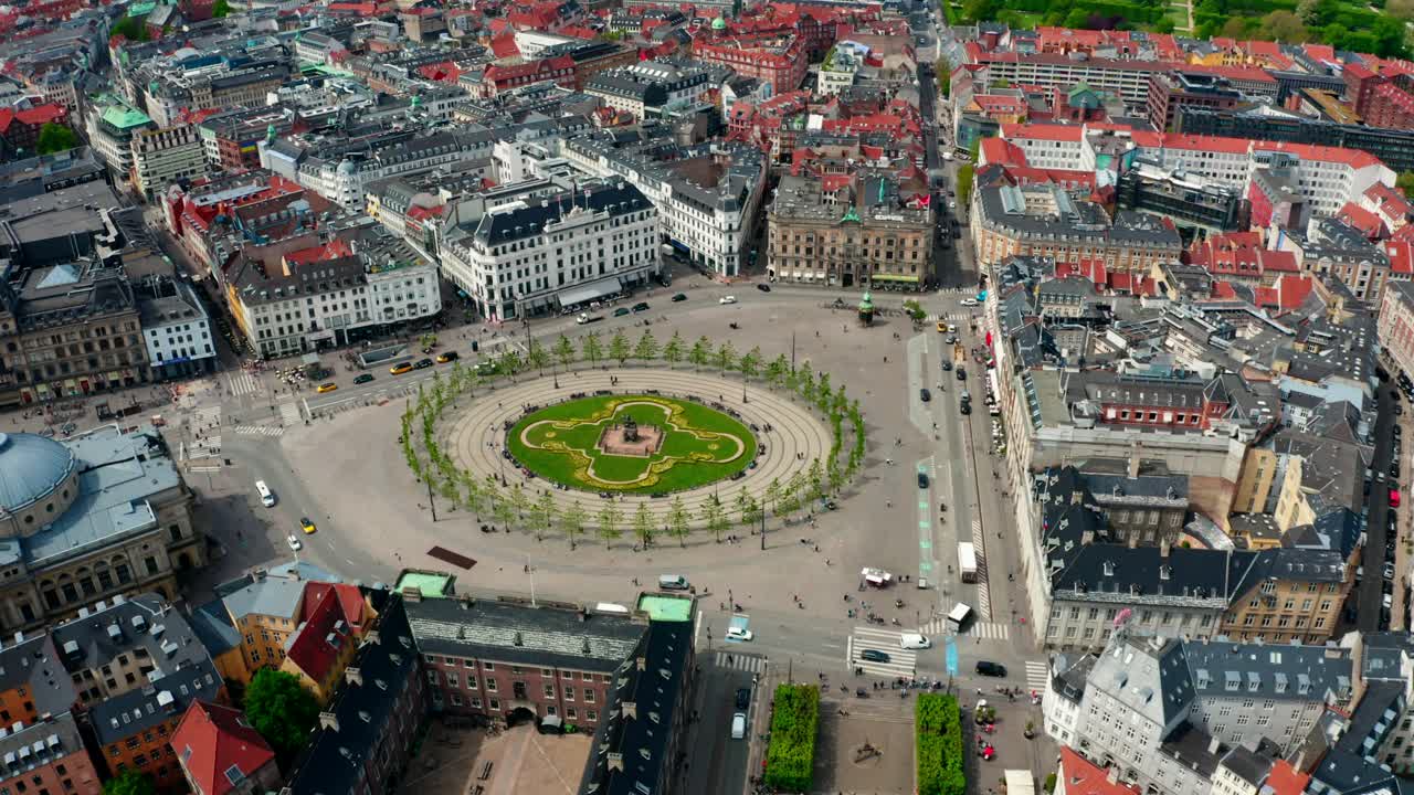 High point view of Copenhagen's Kongens Nytorv square ( The King's New square). A grand square surrounded with baroque style architecture and lively streets.