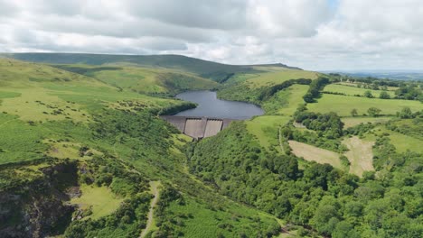 aerial fly-in of meldon reservoir offering sweeping views over okement valley in dartmoor national park