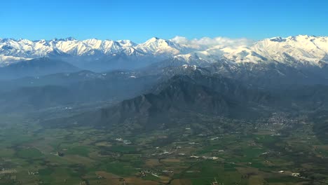 Aerial-footage-of-alpine-mountain-peaks-covered-in-snow