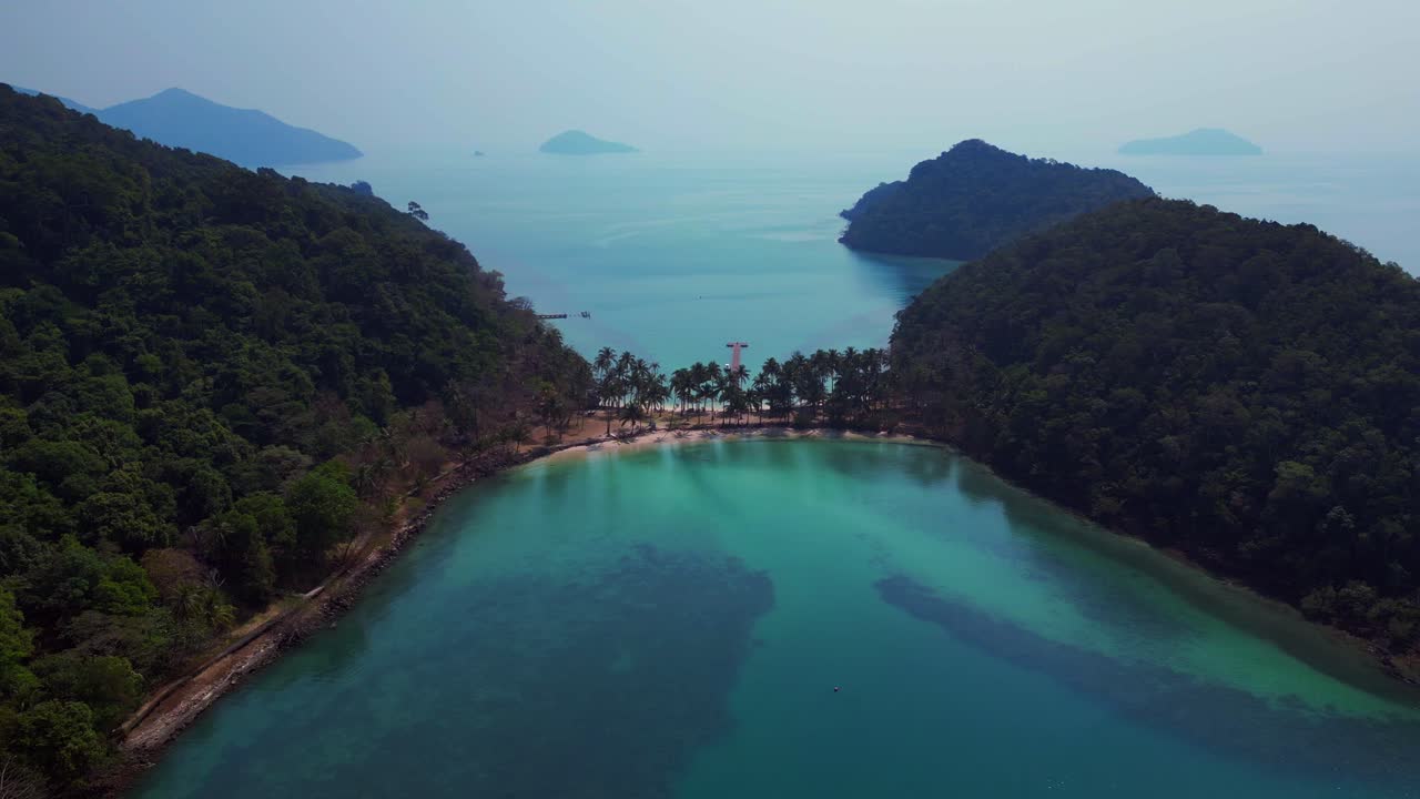 Scenic aerial view of lush green hills and turquoise waters on Koh Chang Ngam Island. Great aerial view flight panorama overview drone