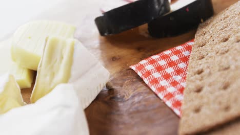 Cheese-with-ham-on-wooden-board