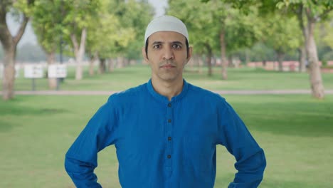 angry muslim man looking to the camera in park