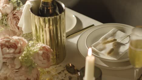 table set for meal at wedding reception with champagne in ice bucket 6