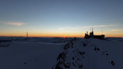 drone shot passing through musala peak, summit during sunset, dusk, bulgaria, rila mountain, highest summit on the balkans, clear sky, amazing, stunning view, twilight, blue hour, golden hour