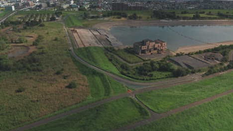 drone flying towards the arakawa river in saitama, japan - aerial