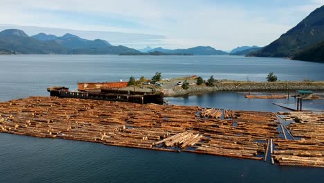 Log-booms-with-mountains-in-background