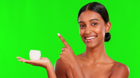 Skincare,-lotion-and-a-woman-pointing-on-a-green