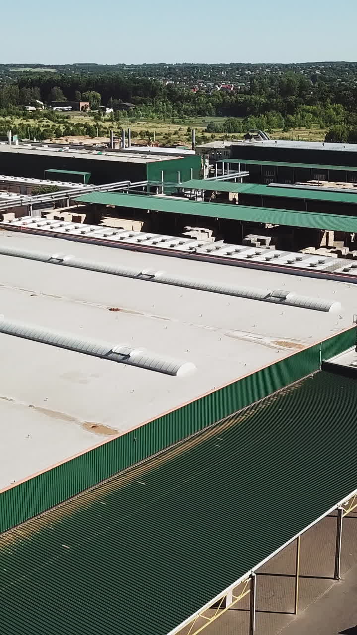 Aerial view of a large wood processing factory. Industrial complex Vertical video