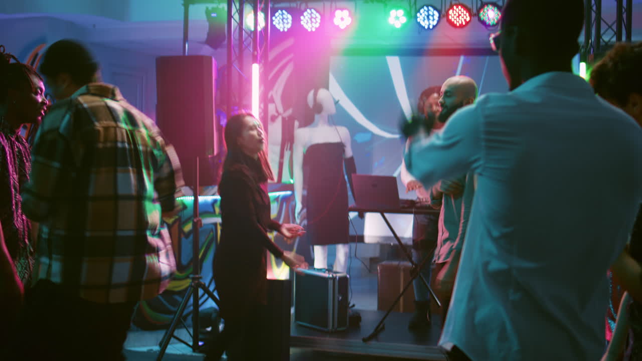 People dancing at a party in a nightclub