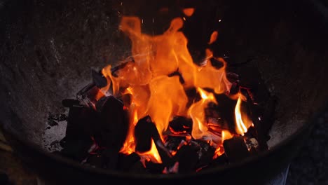 burning charcoal in old barbecue grill for an evening gathering with friends 2