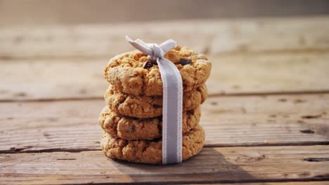 stack of chocolate cookies tied with ribbon 4k