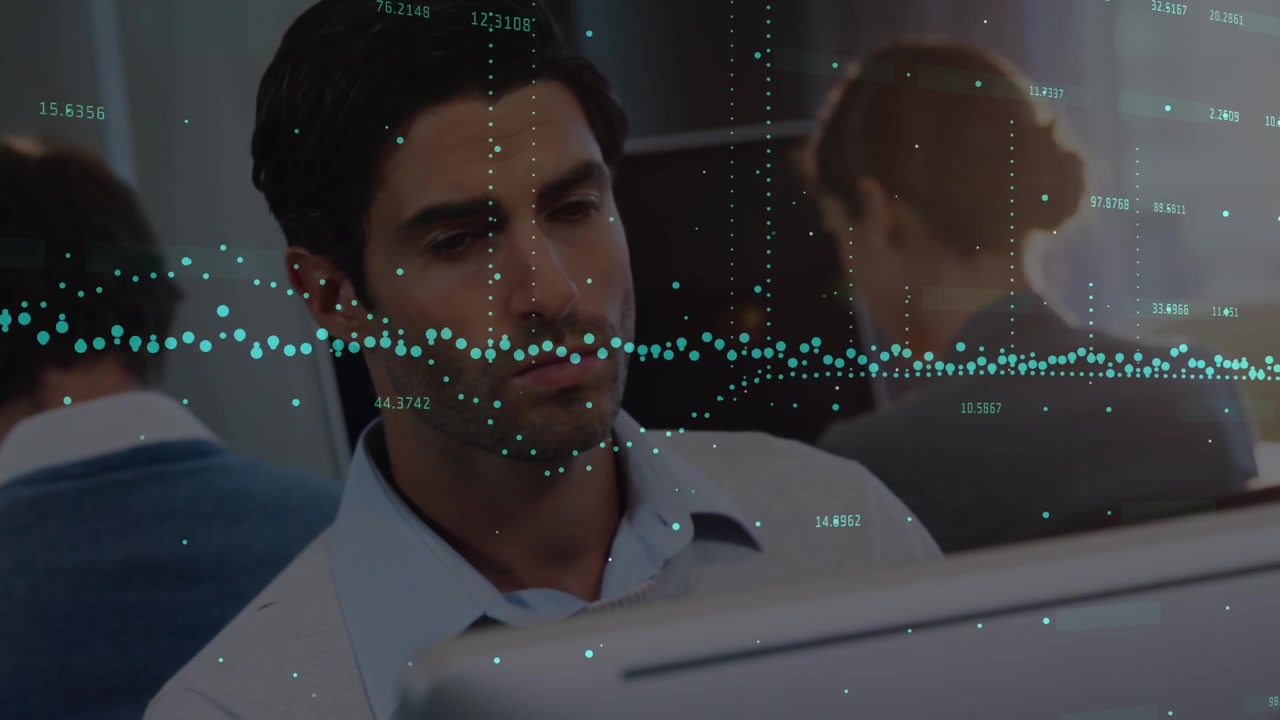 Animation of financial graphs over caucasian man working in office