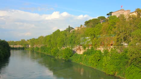 tiber river in the center of rome in italy - panning shot