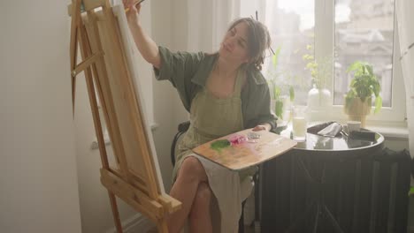 woman painting at home