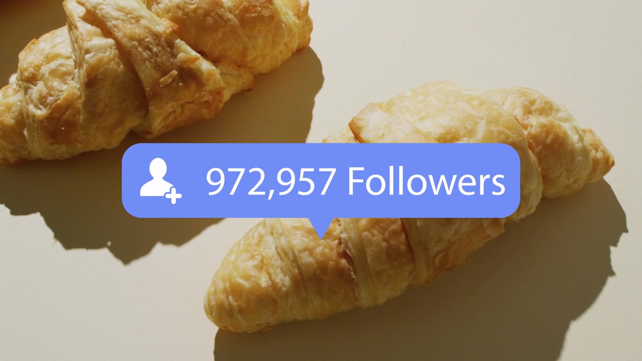 Blue follower badge appearing above left croissant, shifting toward center and counting to million