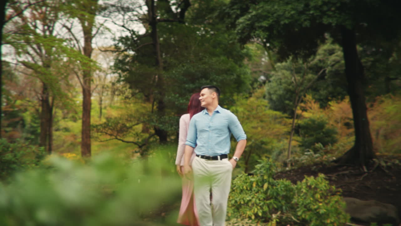 A couple getting engaged in a park