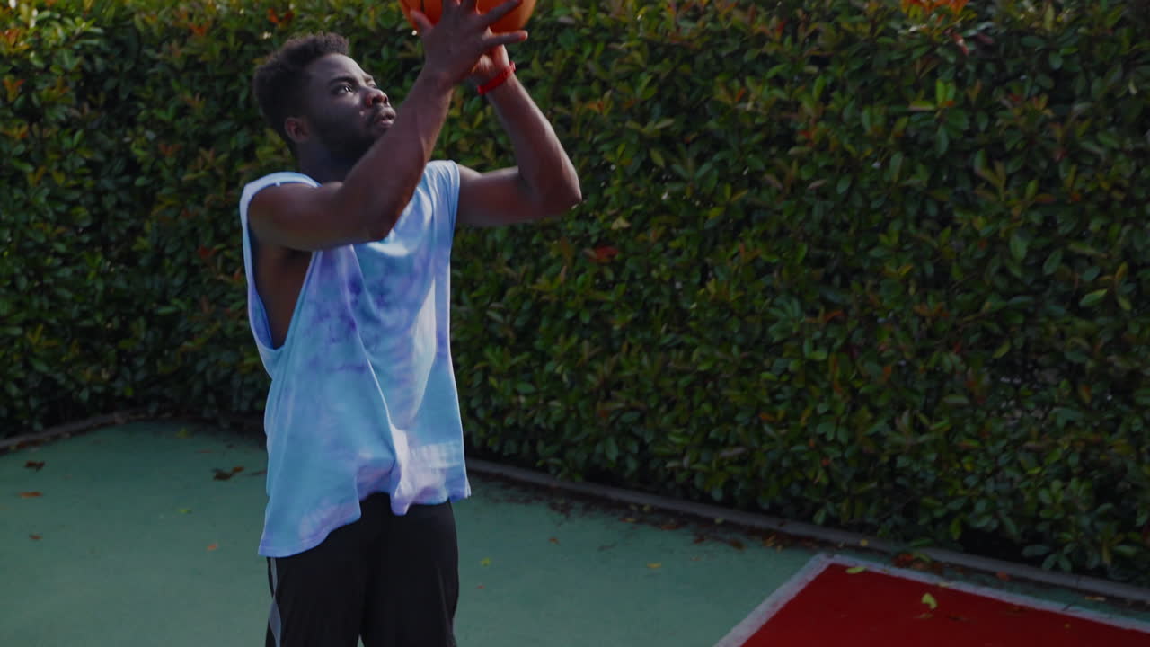 Man Playing Basketball Outdoors